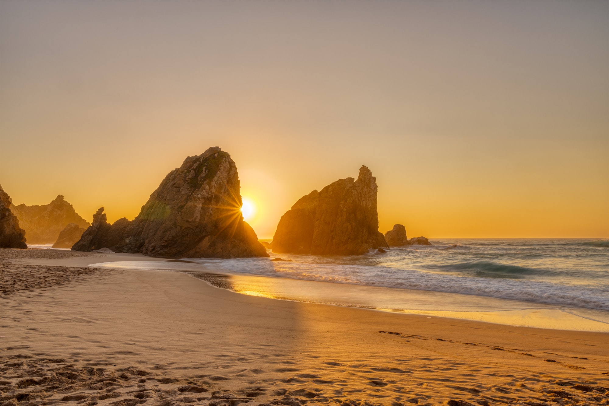 Beautiful sunset on a beach with sea stacks