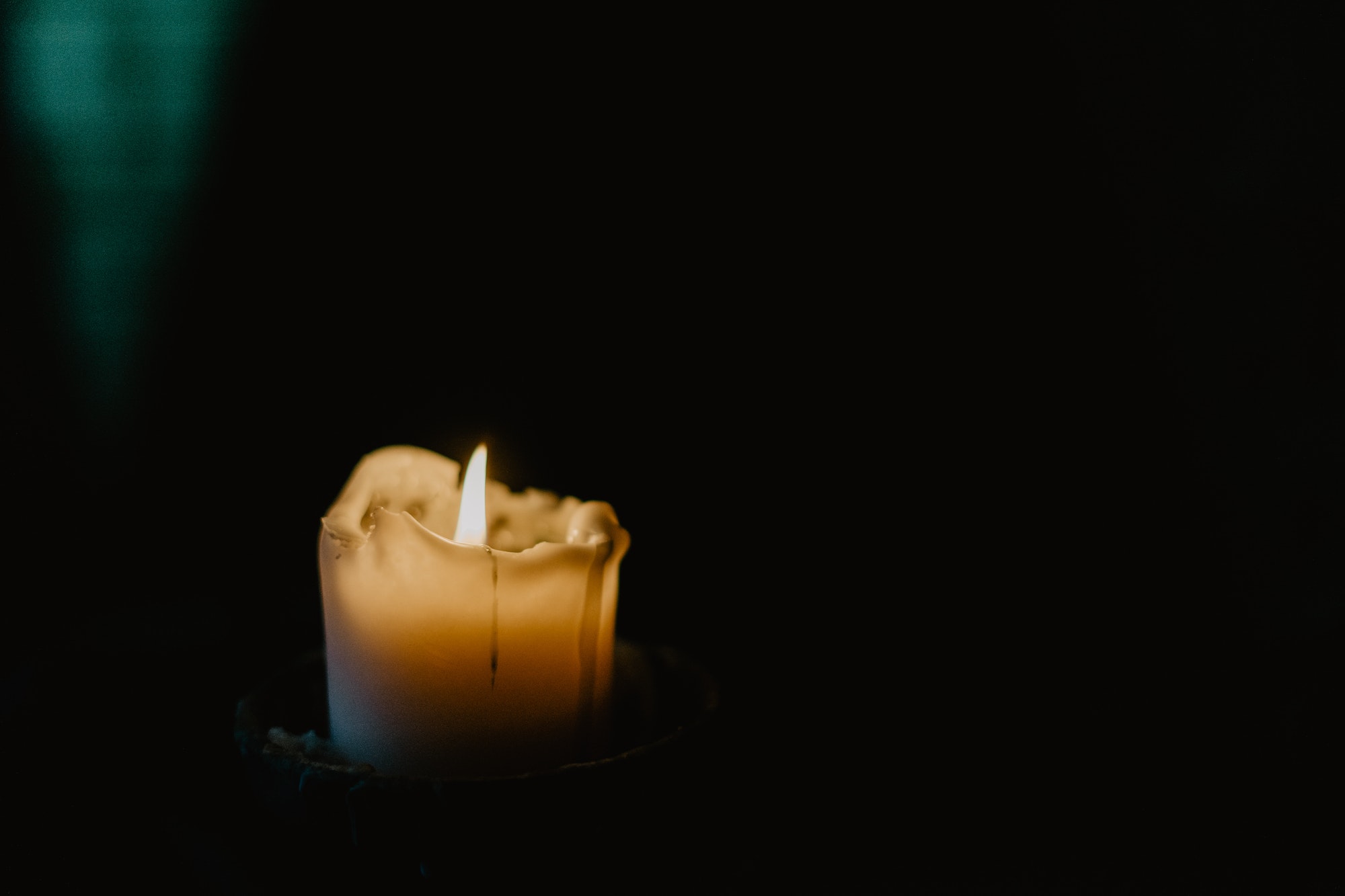 candle in the shadows / religion / grief
